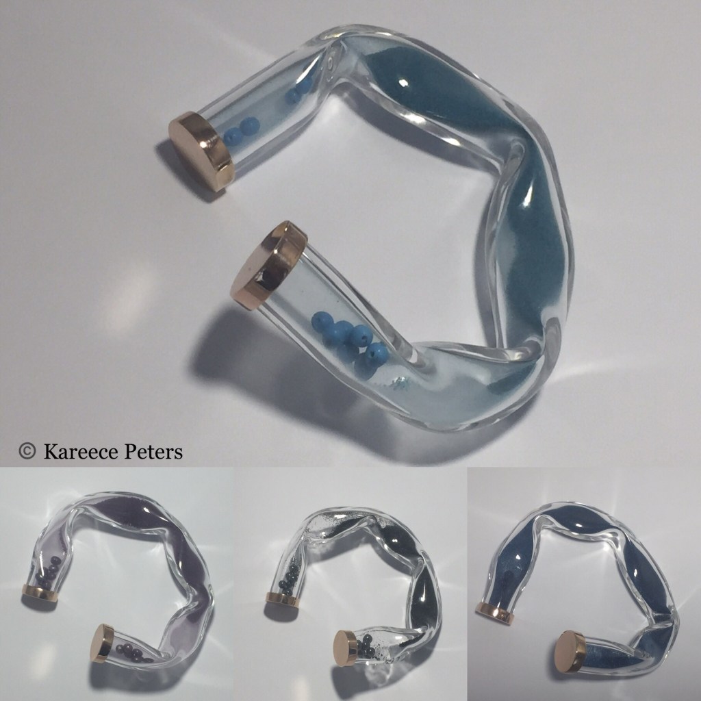 4 Bangles from the Sand & Sea collection in blue, turquoise, purple, and black, with rose gold plated silver 